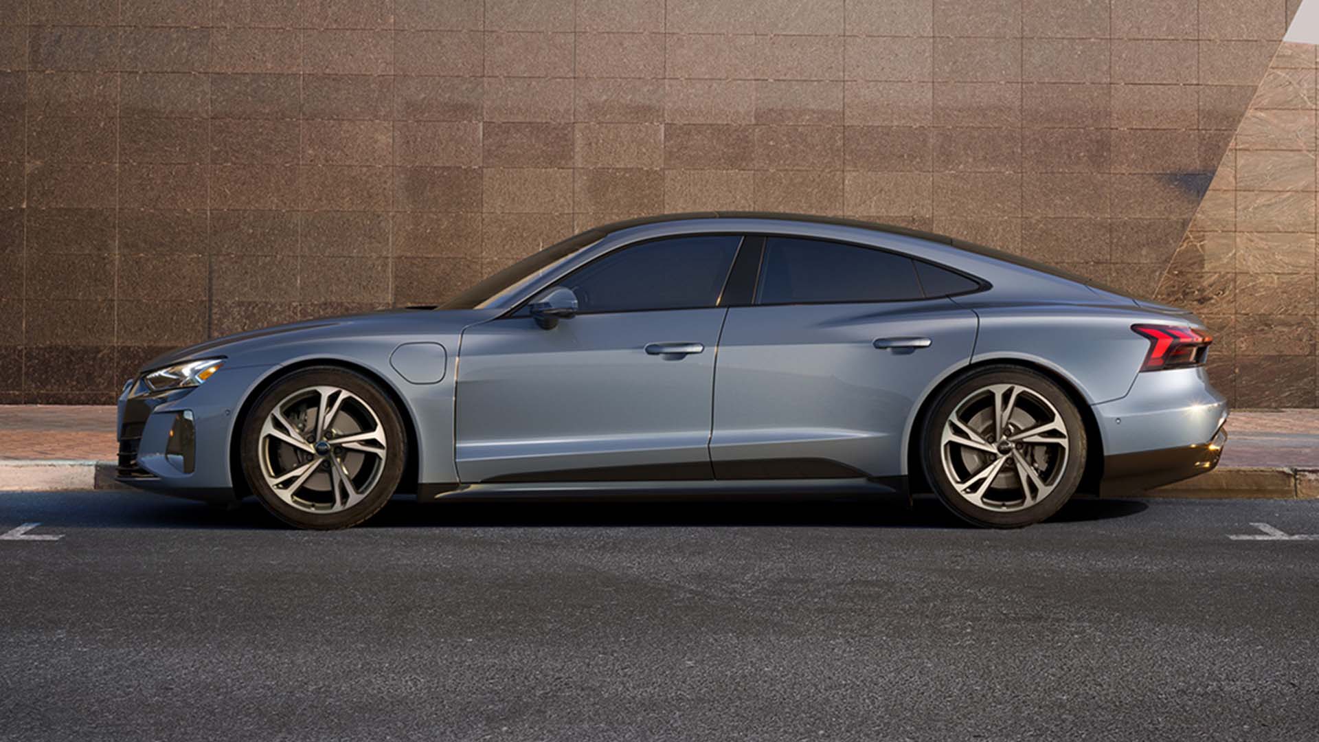 Left side profile view of an Audi parked.