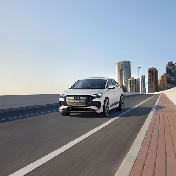 Front profile of the Audi Q4 Sportback e-tron in motion.
