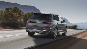 Rear view of an Audi SQ7 accelerating.