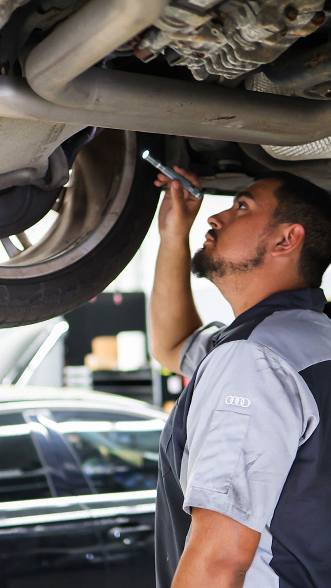 Front profile view of an Audi Q5 vehicle being serviced.