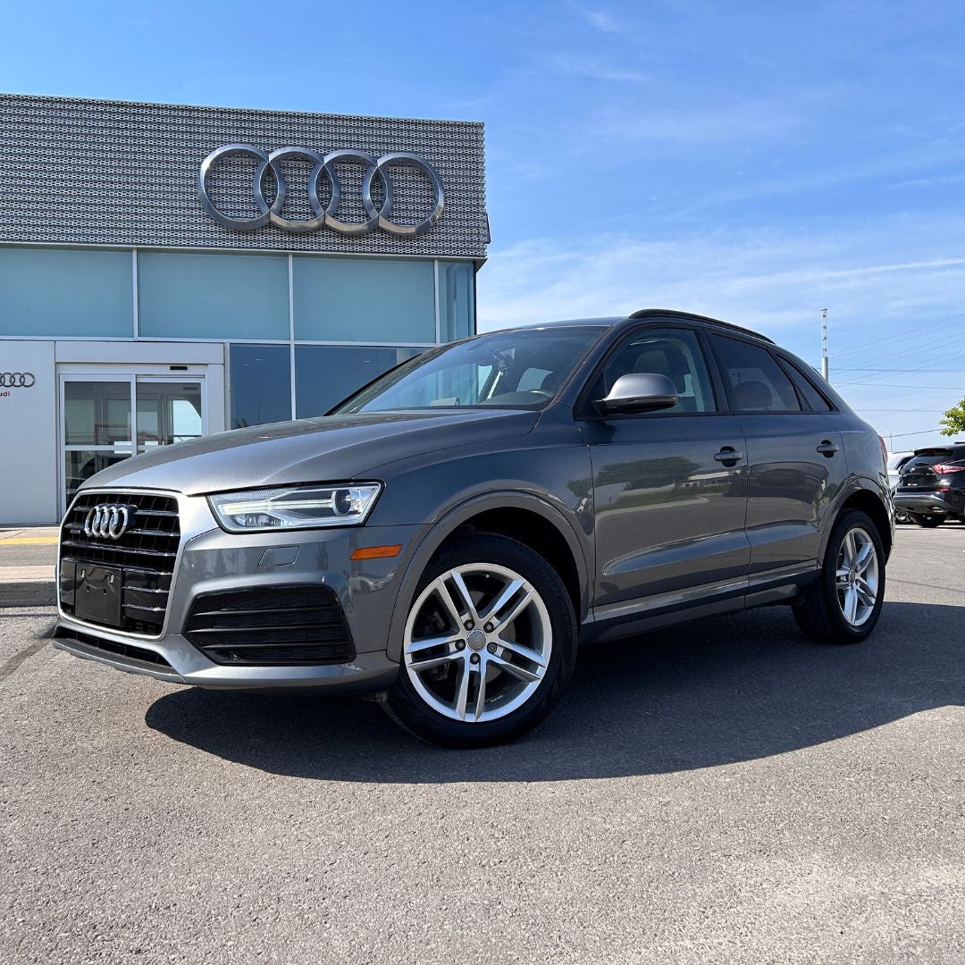 image of a 2018 Audi Q3 in front of Audi Kingston
