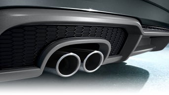Close-up on the sport exhaust on an Audi vehicle.