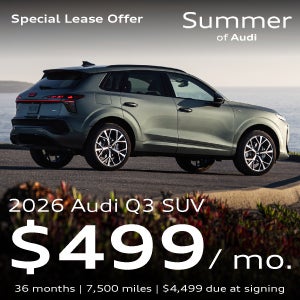 An Audi Q3 parked near water.