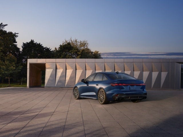 Audi S5 parked, with a wide view from back corner