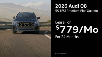 Front view of an Audi Q8 driving.