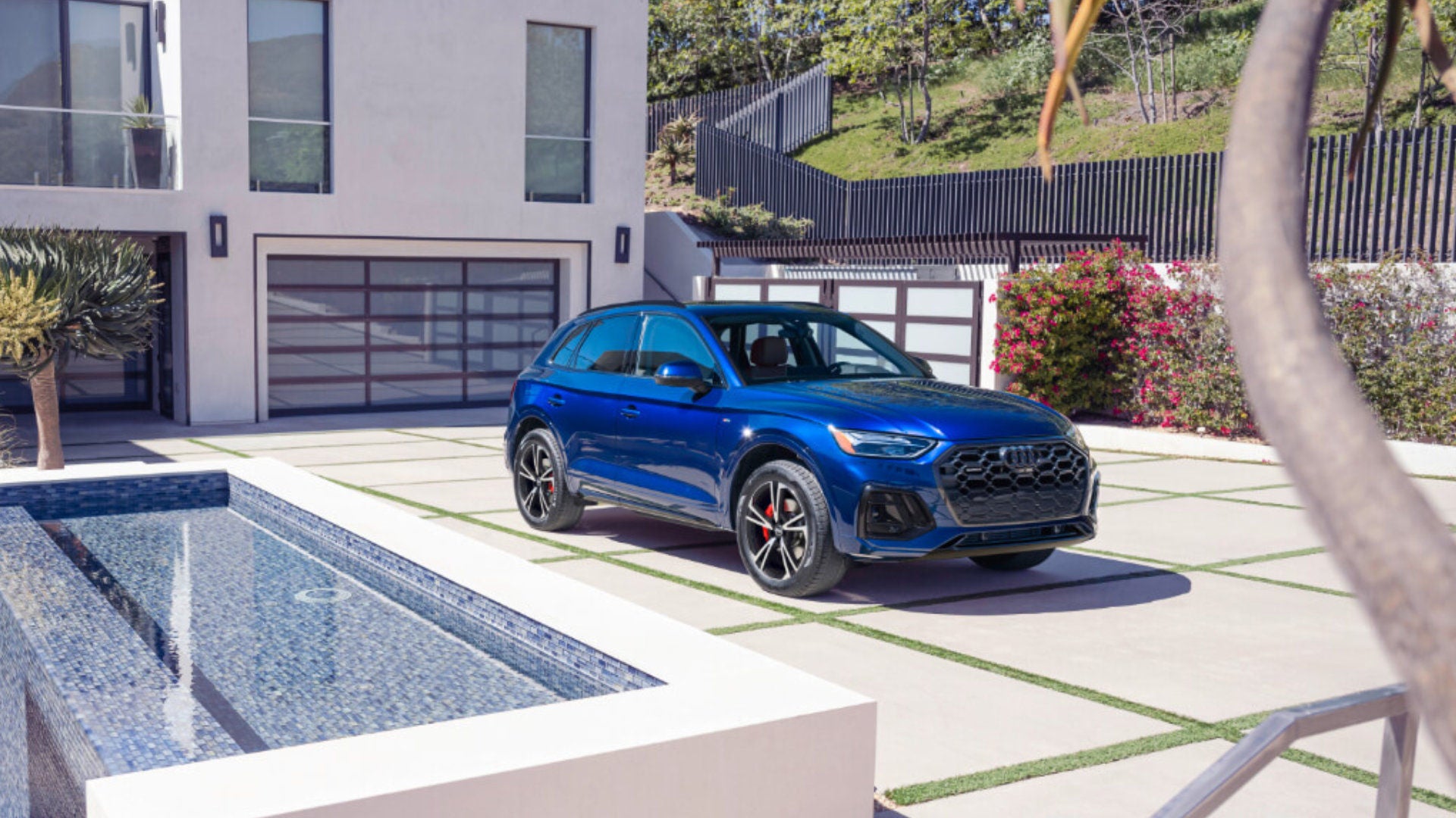 2025 Audi Q5 Exterior Parked in Driveway By House with Waterfall
