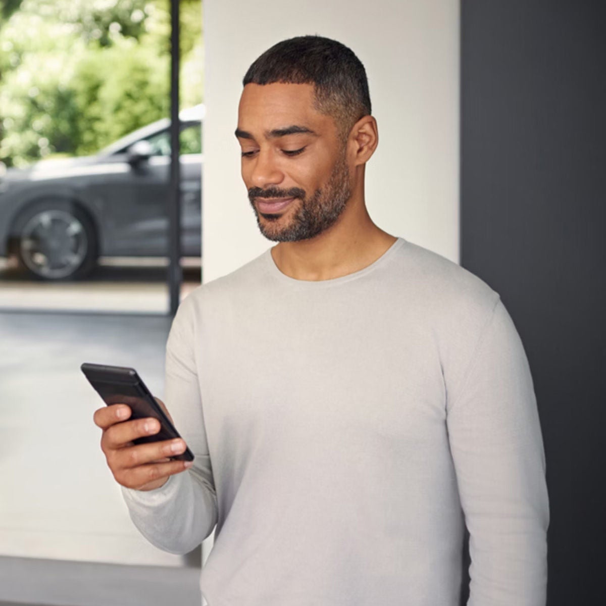 Audi customer on their phone 