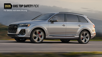 Side view of an Audi Q7 driving.