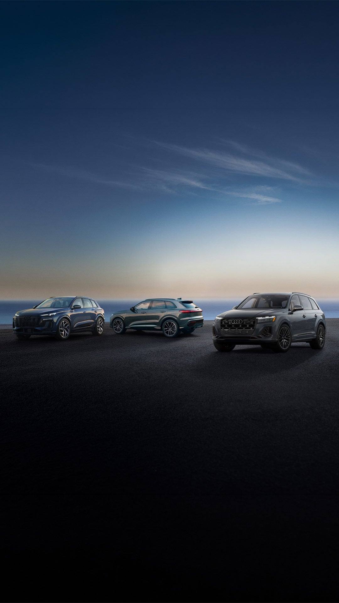Three Audi cars in profile, side by side.