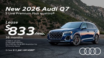 Side view of an Audi Q7 driving.