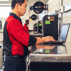 technician typing on computer