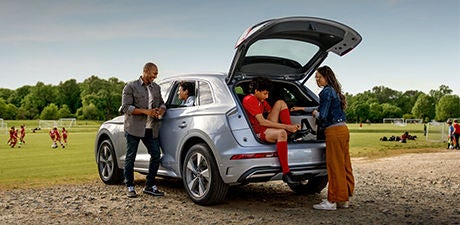 Right side profile view of an Audi Q8 SUV parked.