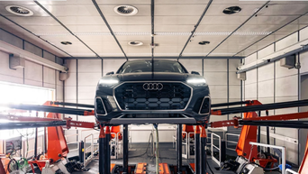 Audi technician servicing a vehicle 