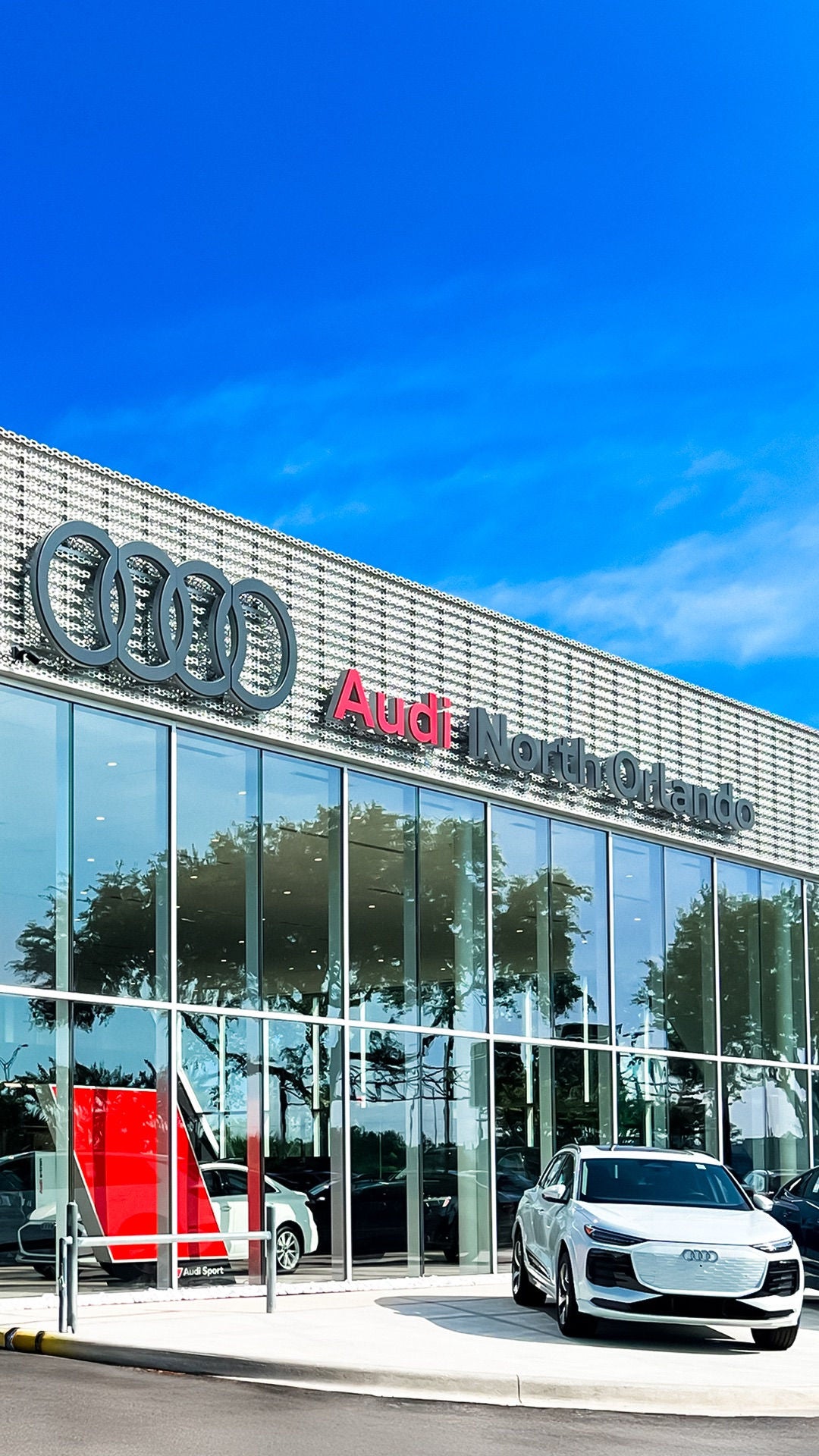 Audi 2025 Audi Q6 e-tron left profile driving.