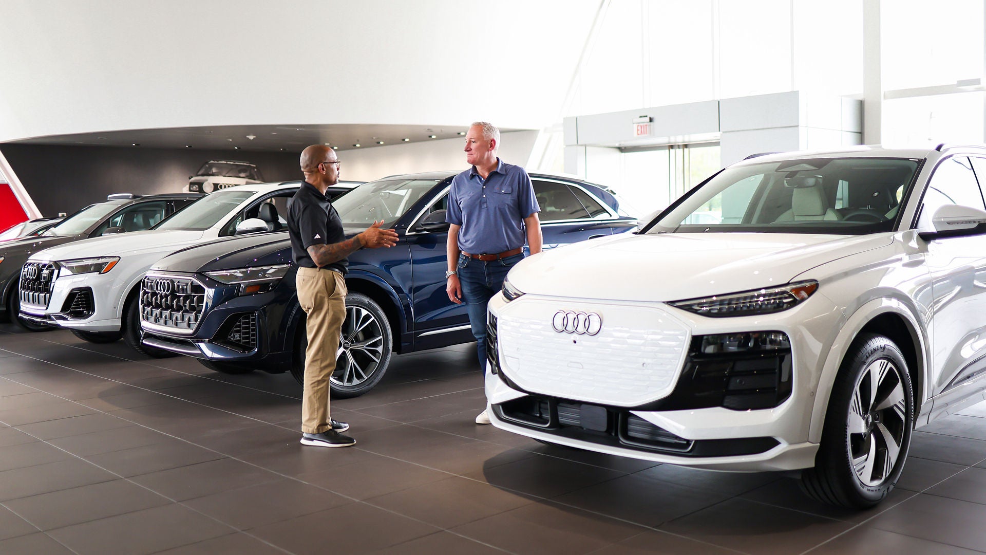 Audi employee polishing an Audi SUV