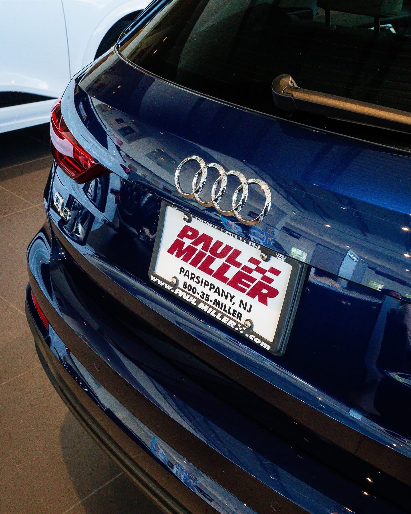 Rear profile view of an Audi Q5 parked.