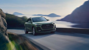 Front profile of an Audi Q5 on the highway.