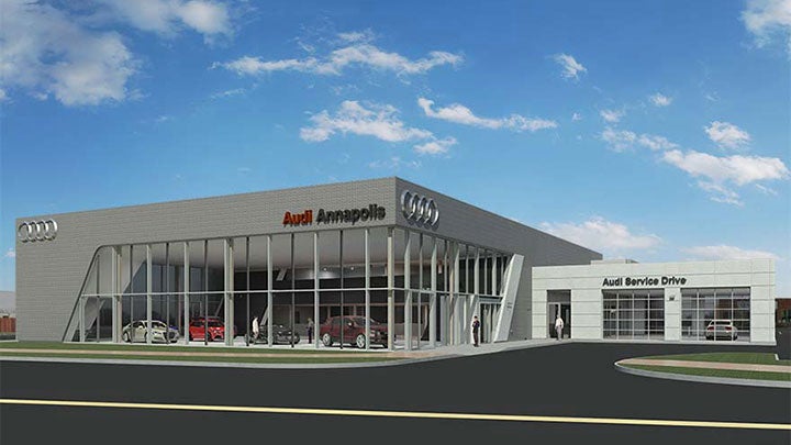 Audi Sale Specialist explaining vehicle features to a customer.