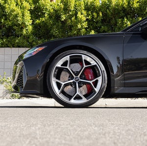 side profile of Audi vehicle parked and tire centered
