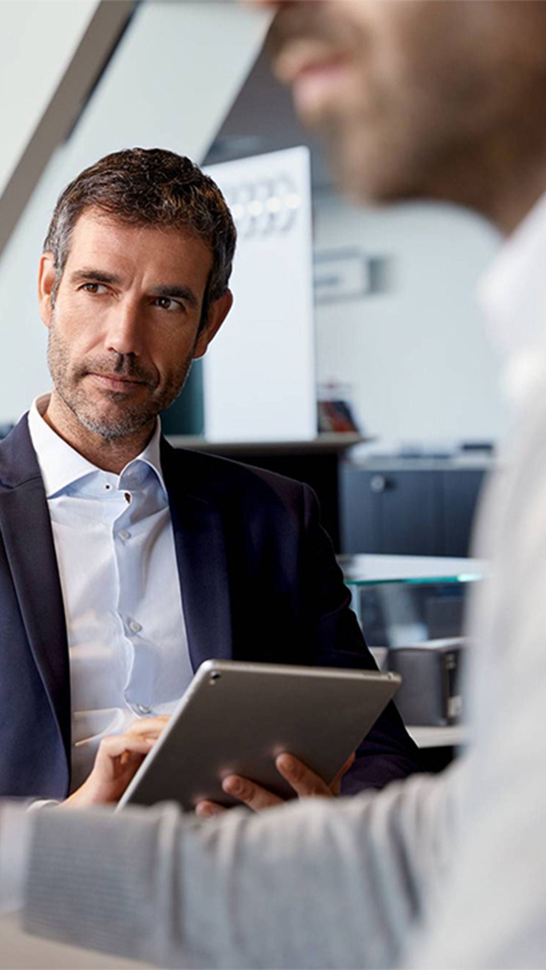 Audi finance manager taking notes.