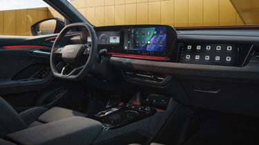 Interior view of the driver's cockpit of the Audi SQ6 Sportback e-tron, showing the interior lighting technology.