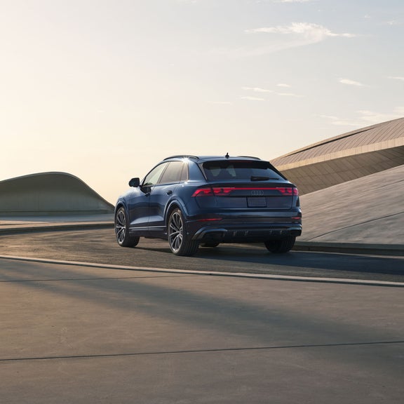 Rear view of the Audi Q8 accelerating.