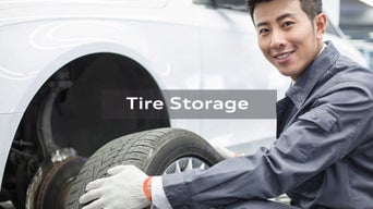 Audi Uptown Service Technician changing a wheel on an Audi vehicle