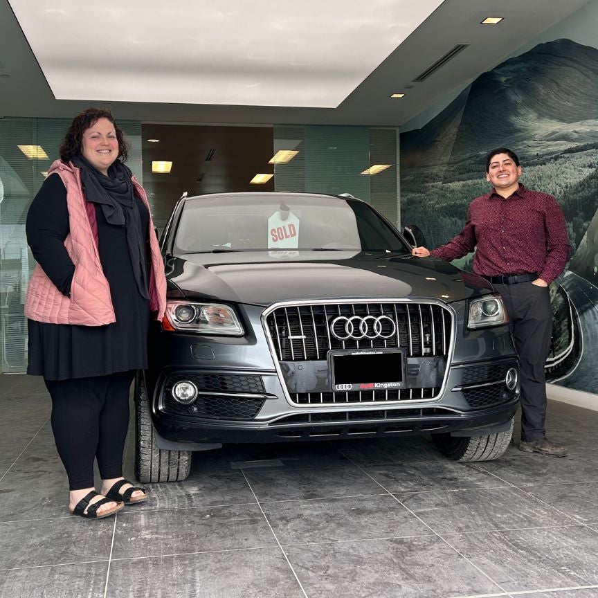 Image of an Audi Q5 being delivered to a female customer