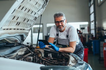 Mechanic inspecting a car