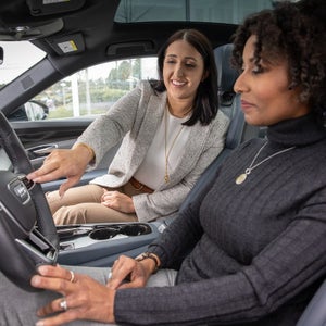 Customer getting oriented in an Audi — schedule a pre-owned test drive at Audi Sewickley near Pittsburgh