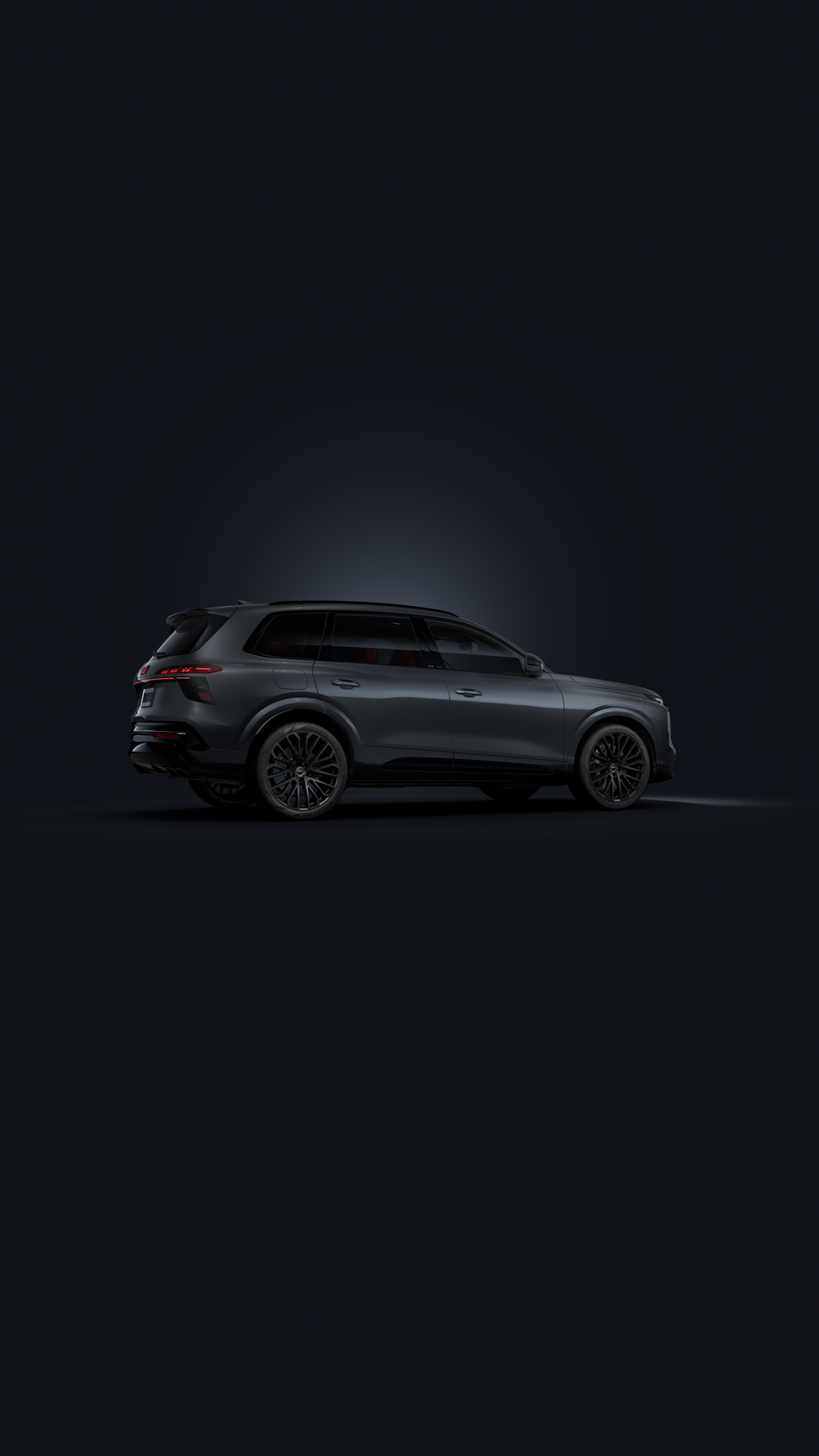 Slanted front view of the Audi SQ7 SUV against a dark background.