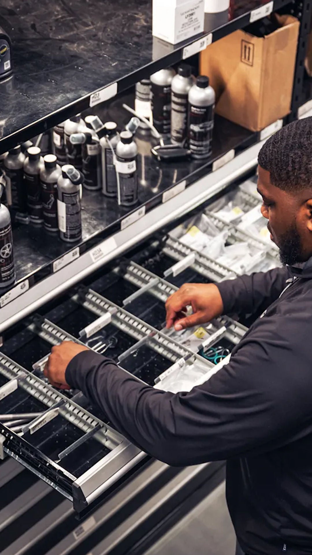 Audi service technician servicing.