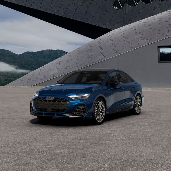 Three-quarter front view of the Audi S3 parked by a futuristic structure.