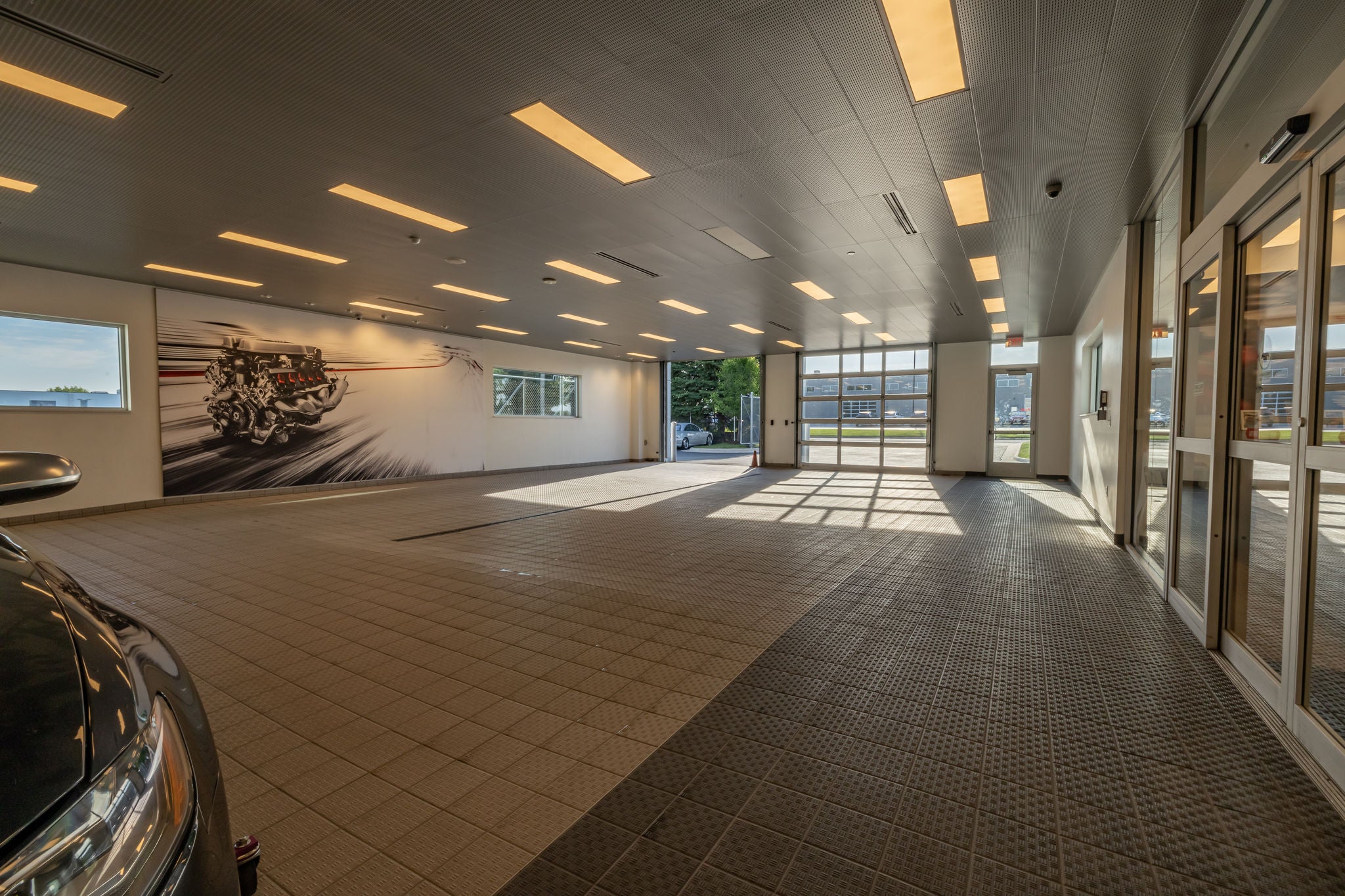 Audi service technician servicing a vehicle.