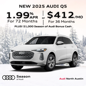 Side view of an Audi Q5 driving.