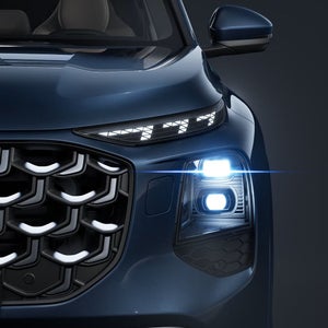 Close-up on a front headlight of the Audi Q7.
