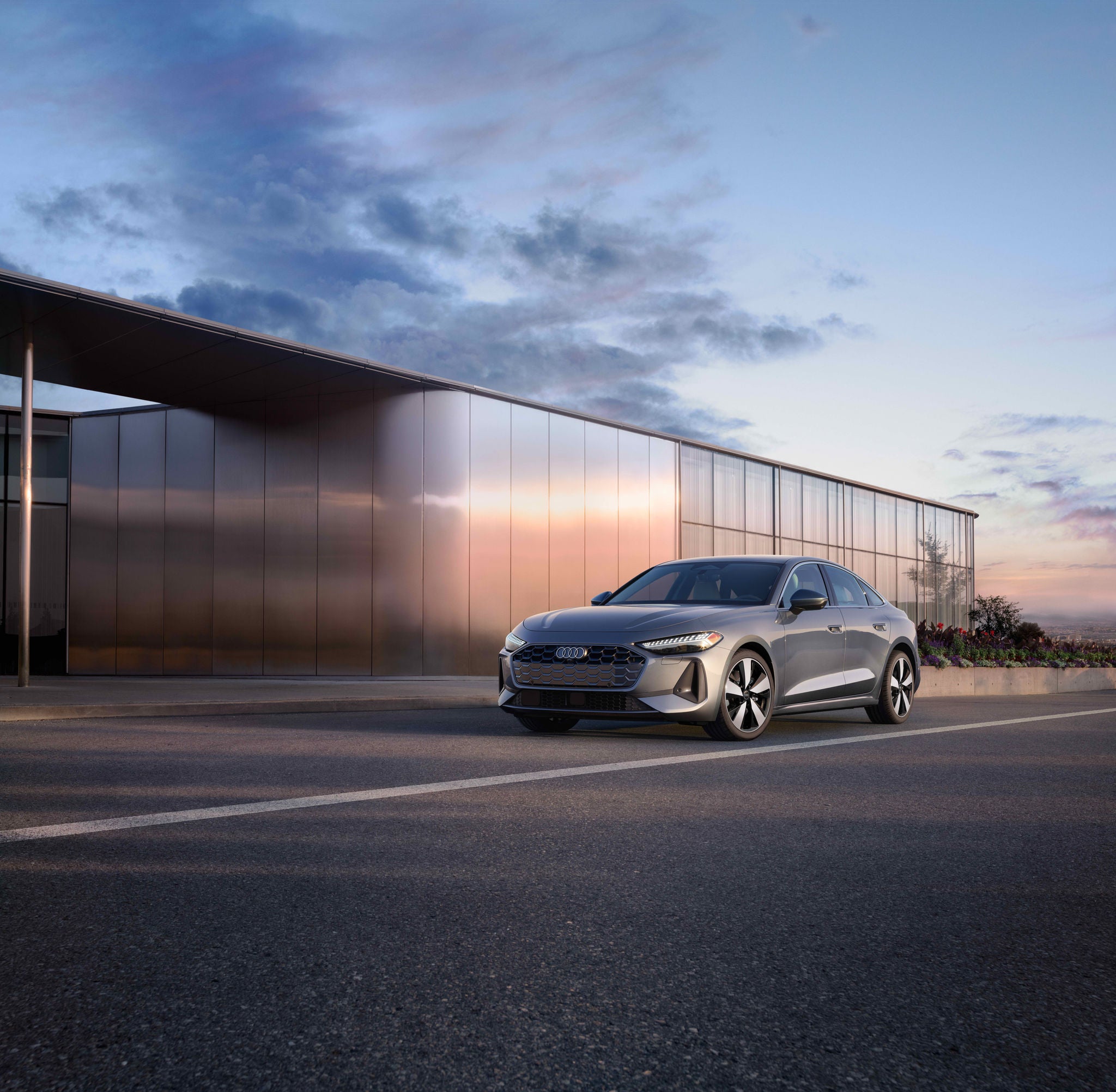 Left profile view of an Audi A5 parked.