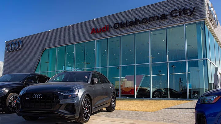 Audi Oklahoma City Dealership with black Audi SUV's outside 