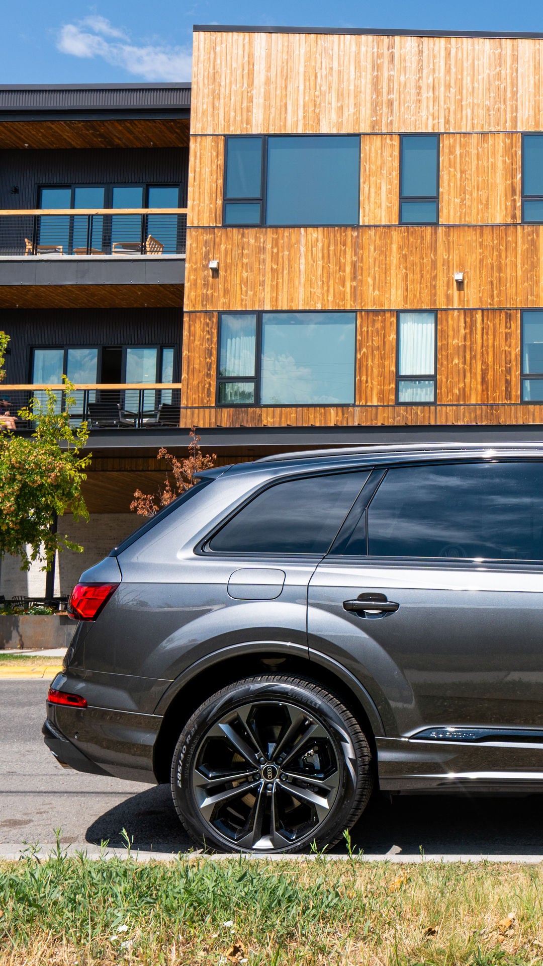 Side profile view of an Audi vehicle parked.