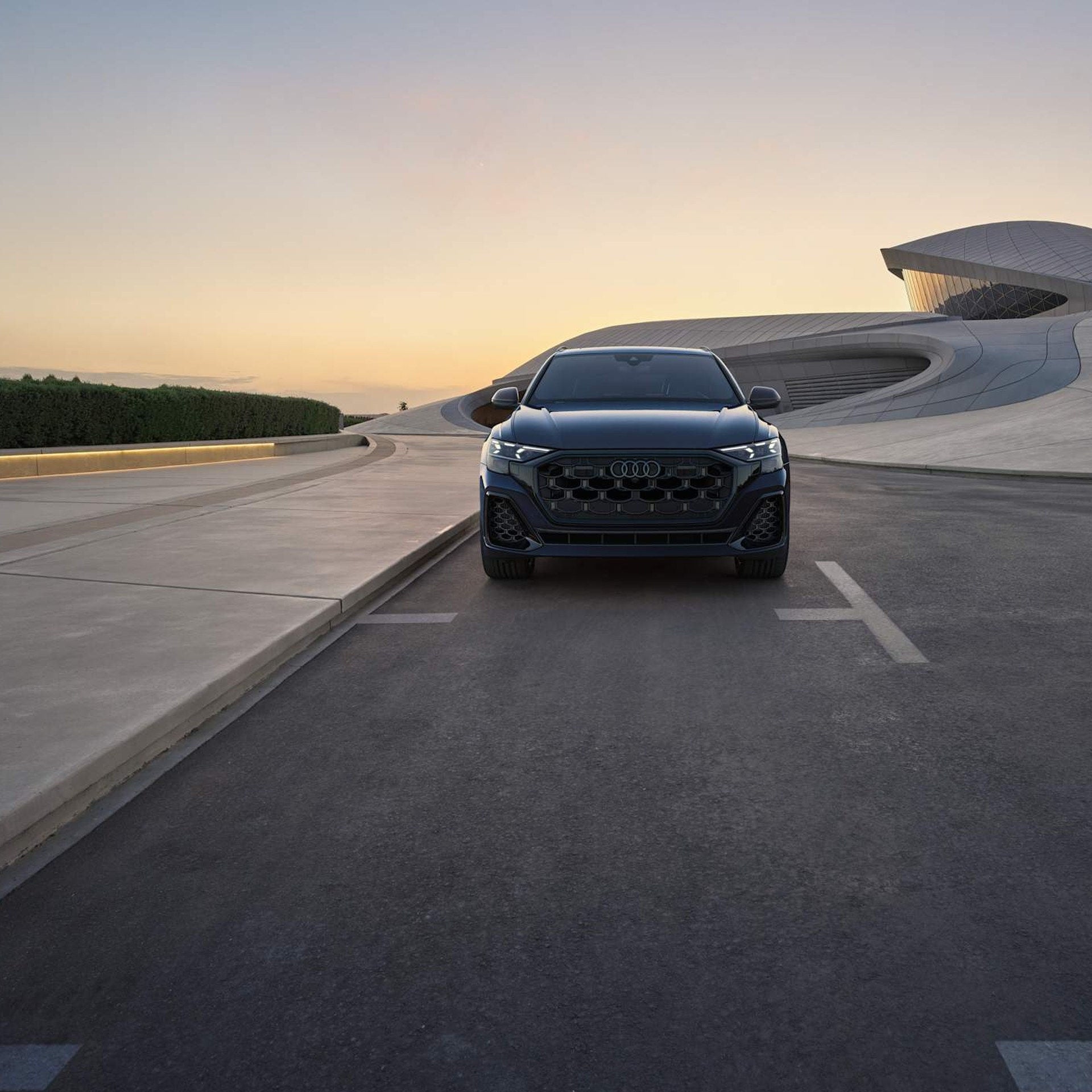 2026 Audi Q8 on the open road, Ultra Blue.