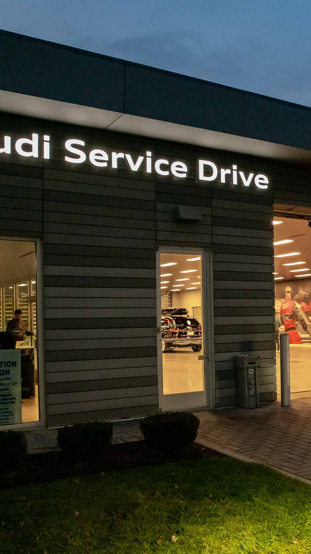 Audi service technician servicing a vehicle