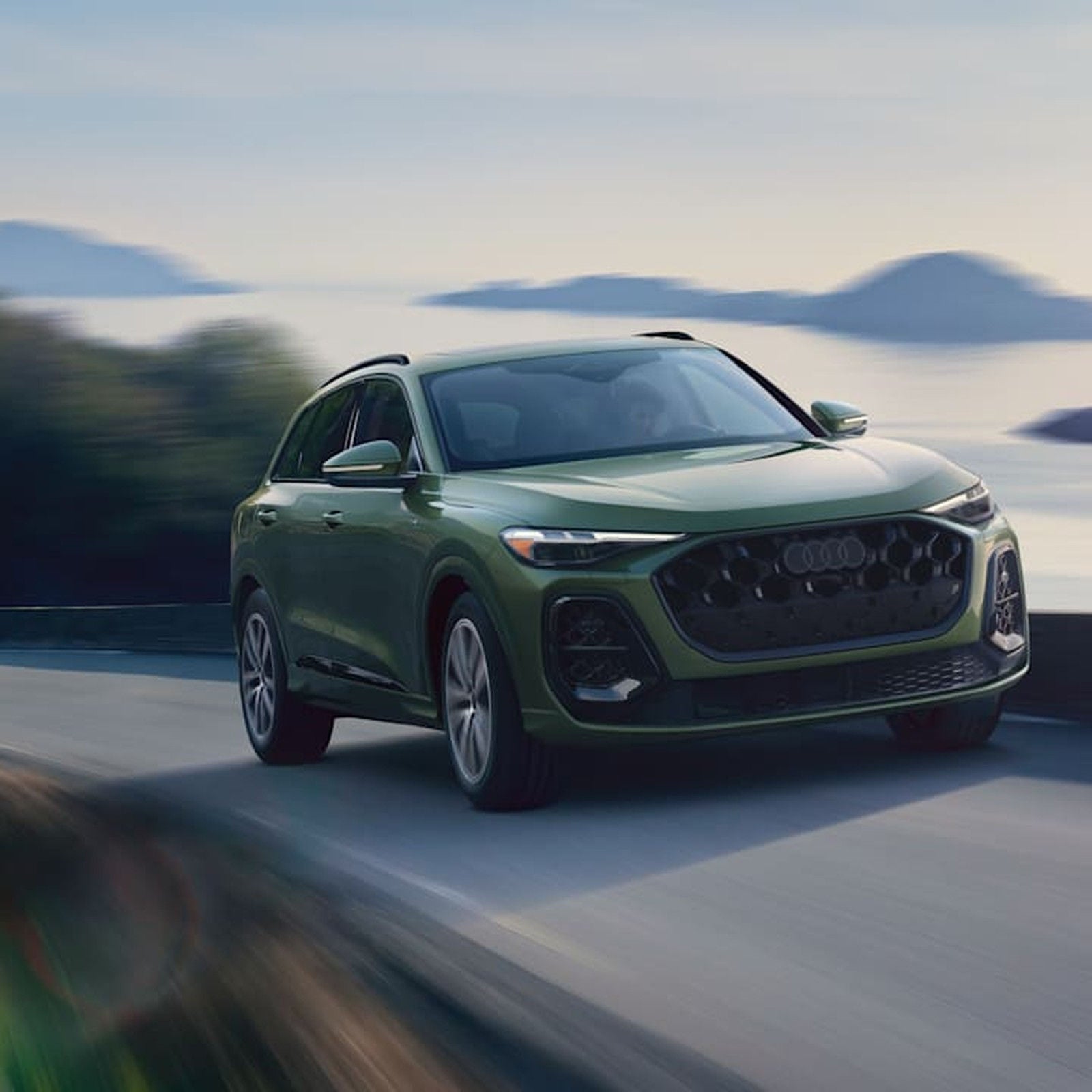 2026 Audi Q5 front three-quarter in motion.