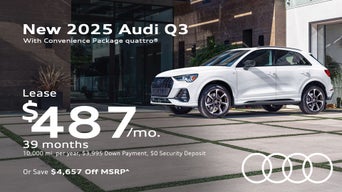 Side view of an Audi Q3 parked.