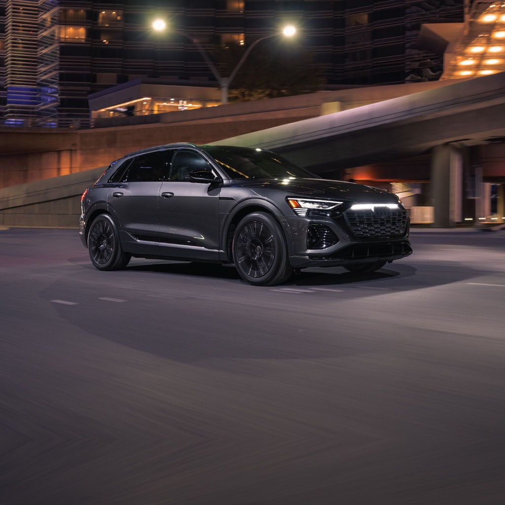 Right profile view of an Audi Q8 e-tron parked.