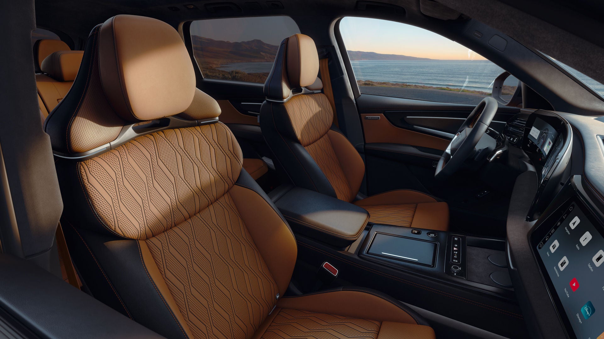 A view of the interior of the Audi Q9 SUV through the front passenger door. The focus is on the elegant seat covers from Audi exclusive.