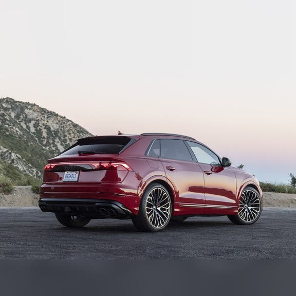 2026 Audi SQ8 rear three-quarter — full-width LED light strip and quad exhaust at Audi Sewickley