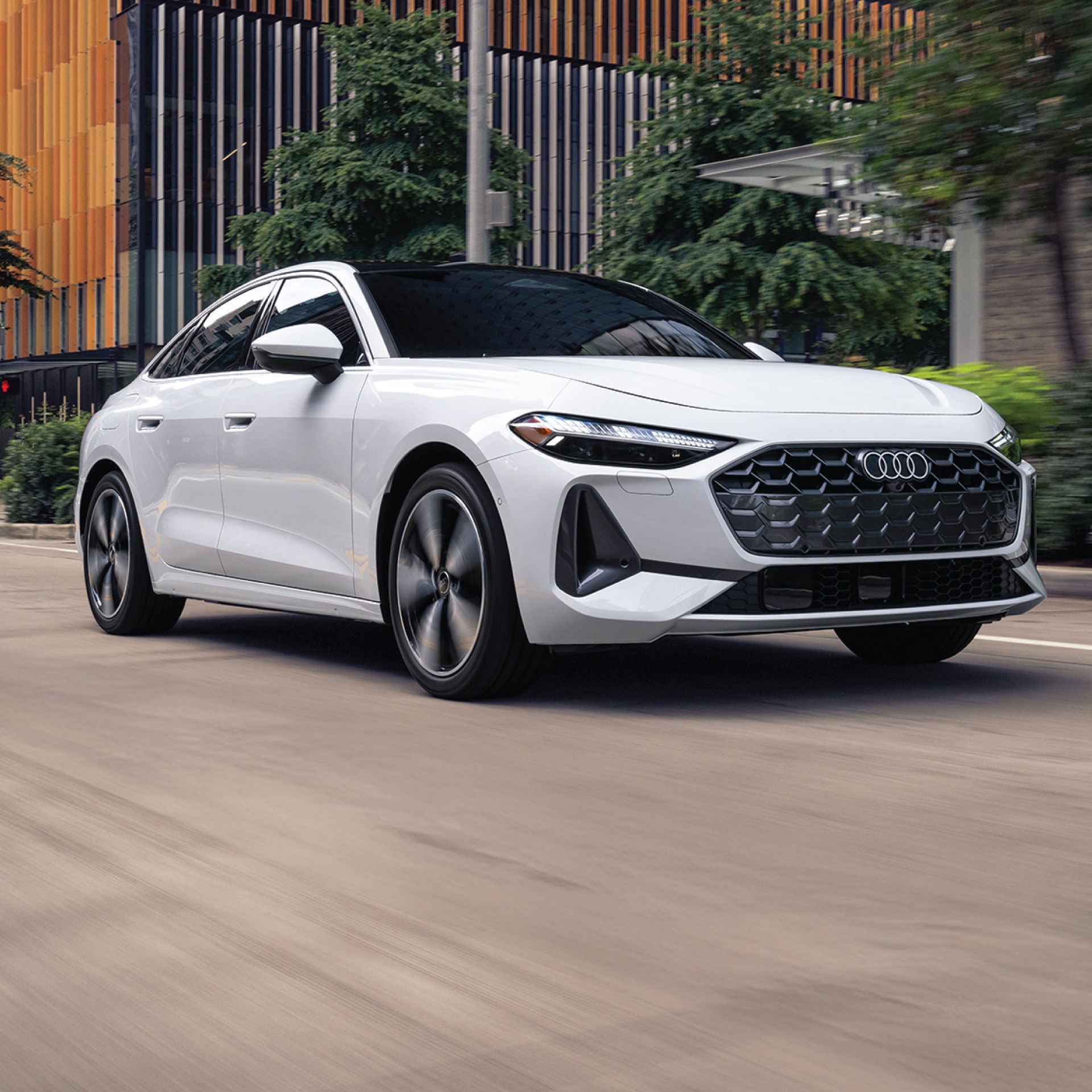 Left profile view of an Audi A5 parked.
