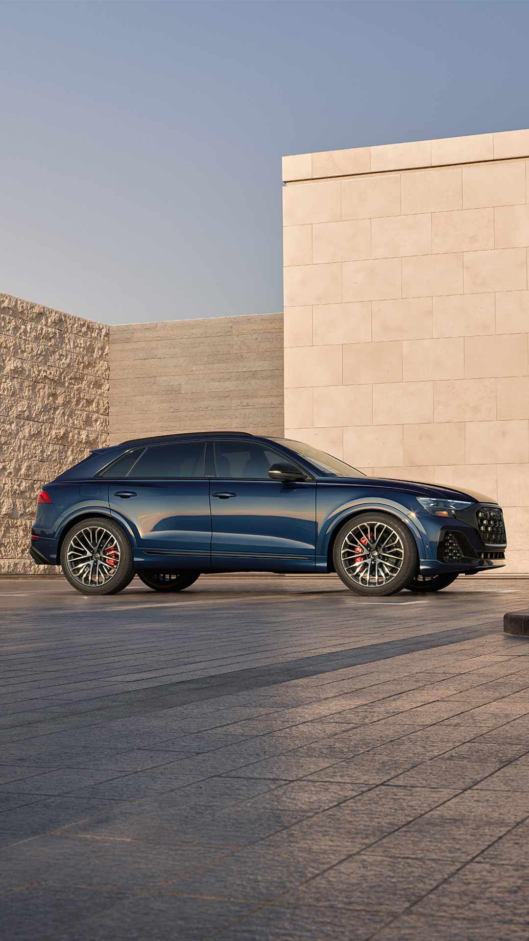 Side profile view of an Audi vehicle parked.