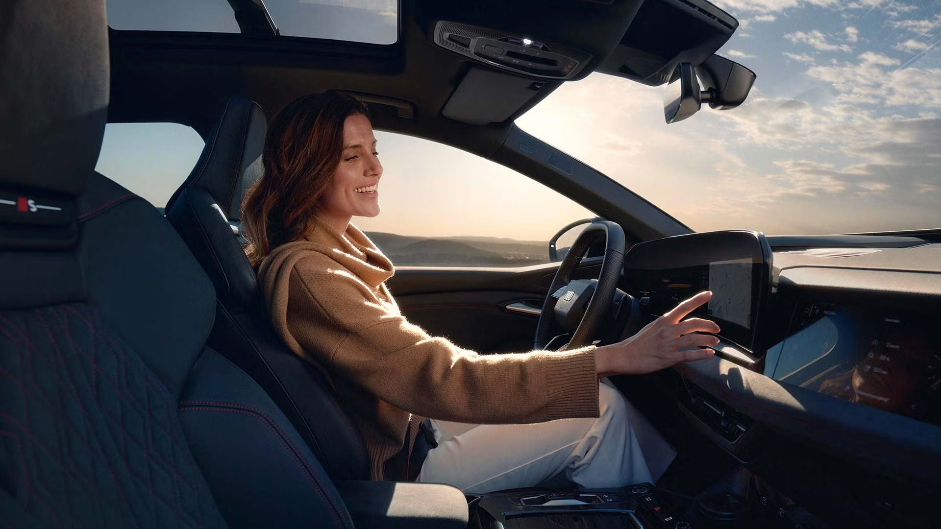 Client inside of their Audi, using the MMI system