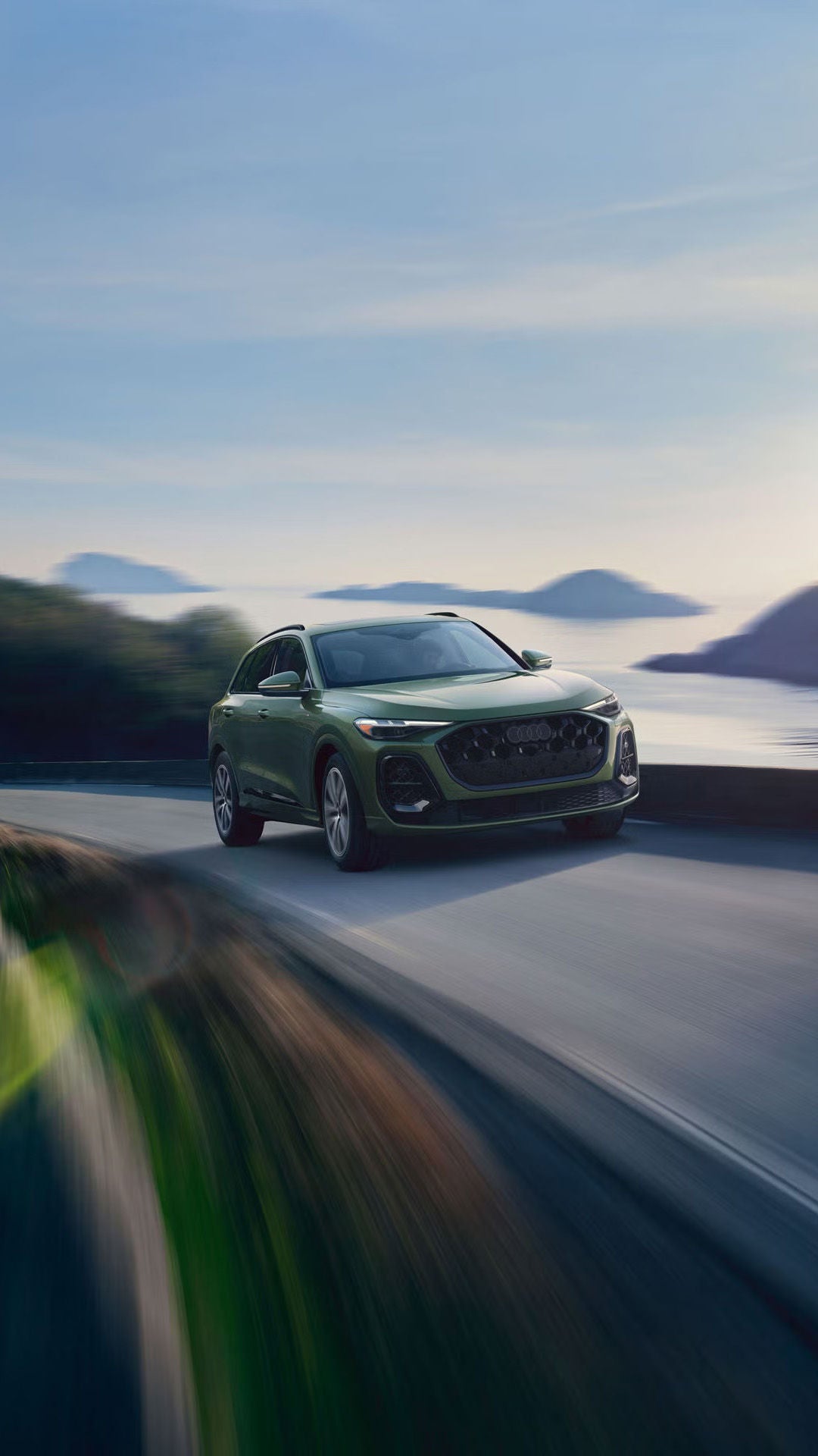 2026 Audi Q5 driving on a coastal road